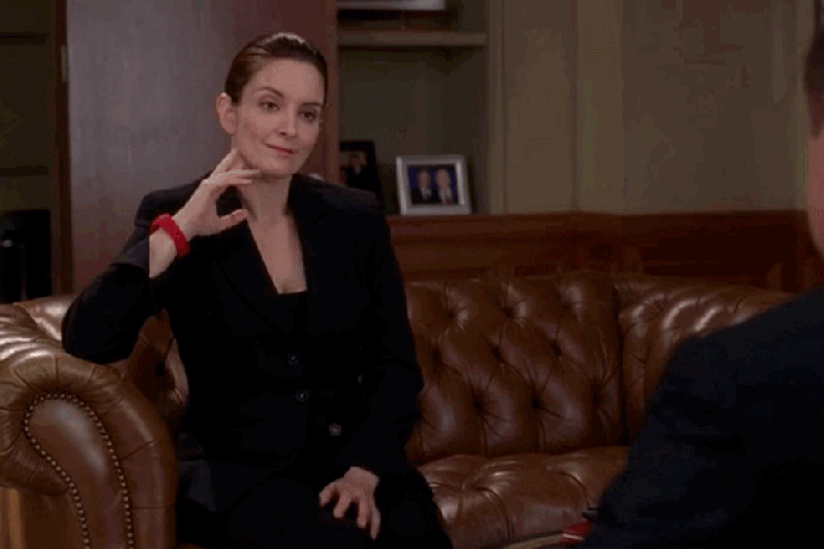 Liz Lemon from "30 Rock" is dressed up for a contract negotiation, but wearing toe shoes.