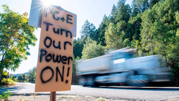 A sign in Calistoga, California, calls on PG&E to turn the electricity back on during a statewide blackout in October 2019.