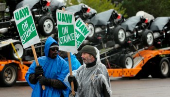 Members of United Auto Workers picket outside of General Motors Detroit-Hamtramck Assembly during the strike on Oct. 16.