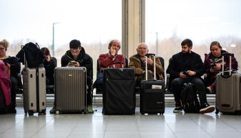 Travelers in London wait for flights ahead of Christmas last year.