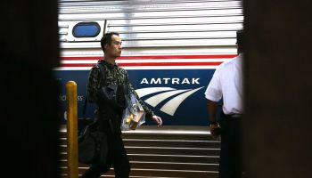 Passengers board an Amtrak train at New York City's Pennsylvania Station.