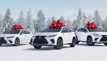 White Lexus cars with red bows against a snowy background, part of the "December to Remember" ad campaign thathas been running since 1999.