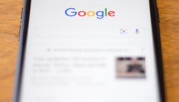 The Google logo is seen on a cellphone in this photo illustration.