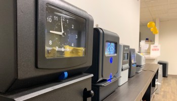 The break room at Lathem Time's headquarters features most of its current lineup, from mechanical time clocks to biometric fingerprint readers.