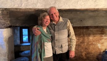Craig Johnson (right) and his partner Carol Adams stand in front of the original hearth at Glen Fern in Philadelphia, PA.