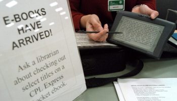 A librarian displays a recently arrived e-book at the Chicago Public Library in 2000.