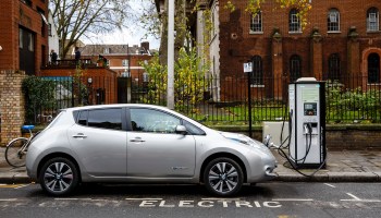 An electric car charges on a London street.