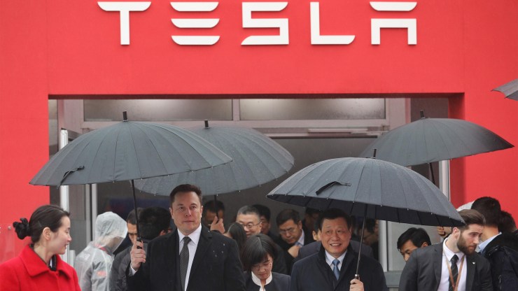 Elon Musk walks with Shanghai Mayor Ying Yong during the groundbreaking ceremony for a Tesla factory in the city in January.