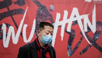 A man wears a mask while walking in the street on January 22, 2020 in Wuhan, Hubei province, China.