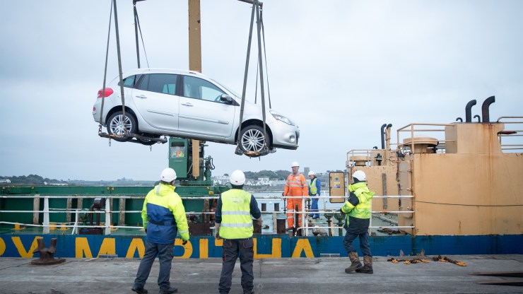 A car is unloaded from a freight ship