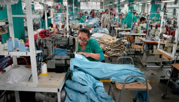 Workers at Kinross Clothing manufacturers in Maitland, sew men's trousers in Cape Town in 2017.