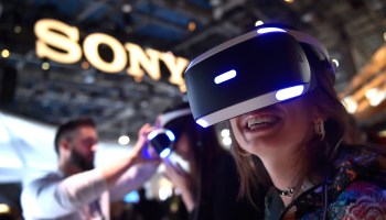 An attendee uses Sony's Playstation VR at the Sony booth during CES 2018 in Las Vegas, Nevada.