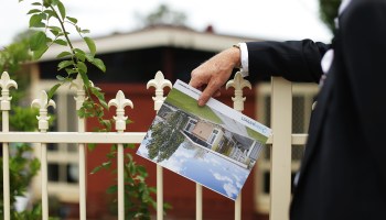 A prospective buyer looks at a property