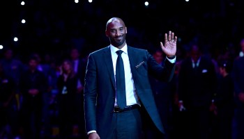 Kobe Bryant smiles at halftime as both his #8 and #24 Los Angeles Lakers jerseys are retired at Staples Center on Dec. 18, 2017, in Los Angeles.