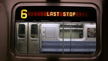 An NYC Subway train flashes a last stop sign
