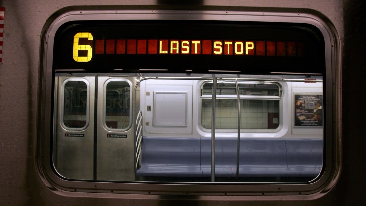 An NYC Subway train flashes a last stop sign