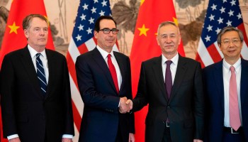 China's Vice Premier Liu He, second from right, shakes hands with U.S. Treasury Secretary Steven Mnuchin at the Diaoyutai State Guesthouse in Beijing in March during trade negotiations.