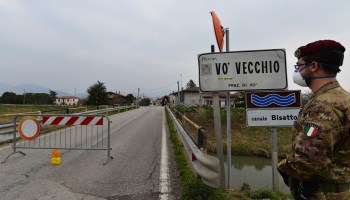 An Italian soldier patrols by a check-point at the entrance of the small town of Vo Vecchio, situated in the red zone of the COVID-19 the novel coronavirus outbreak, northern Italy, on February 24, 2020.