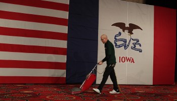 Joe Robinson vacuums the carpet before the start of the caucus night celebration party for Democratic presidential candidate Sen. Bernie Sanders at the Holiday Inn on February 03, 2020 in Des Moines, Iowa.