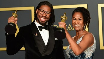 Filmmakers Matthew A. Cherry and Karen Rupert Toliver pose with their Oscars for Best Animated Short Film for "Hair Love" on Feb. 9, 2020.
