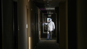A medical staff member disinfecting a hotel in Wuhan, China, on Feb. 3, 2020.