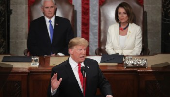 President Donald Trump delivering the 2019 State of the Union address as Speaker Nancy Pelosi and Vice President Mike Pence look on.