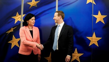 European Commission vice president in charge for Values and Transparency Vera Jourova shakes hands with Mark Zuckerberg in Brussels, on Feb. 17, 2020.