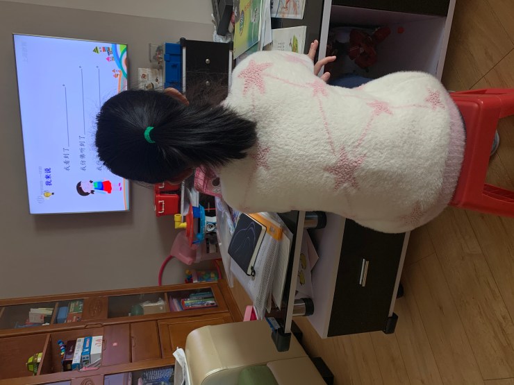 Pearl Zhu attending Chinese class online from her living room. (Courtesy of Carol Jia)