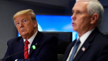 President Trump listens as Vice President Mike Pence speaks during a meeting with FEMA on March 19, 2020