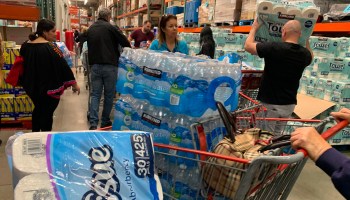 People stocking up on toilet paper, paper towel and water to prepare for the coronavirus at a Costco in Burbank, California, on March 6.