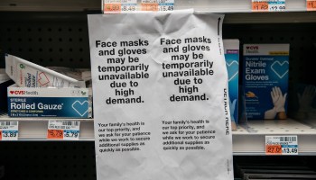 Signs for sold out face masks are posted in a Manhattan pharmacy on February 26 in New York City