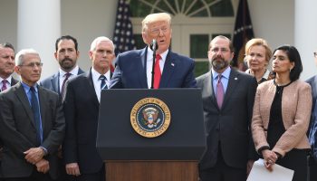 Surrounded by members of the White House Coronavirus Task Force, President Donald Trump speaks at a press conference on COVID-19.