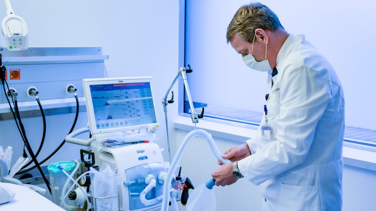A doctor demonstrates the use of a ventilator at a hospital in Germany on March 25