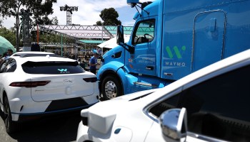 Waymo self-driving vehicles are displayed at the Google I/O 2018 Conference in Mountain View, California.