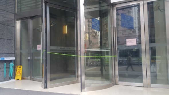Front entrance of Marketplace's Shanghai office block has been closed, forcing people to go through the same side entrance and undergo checks. (Jennifer Pak/Marketplace)