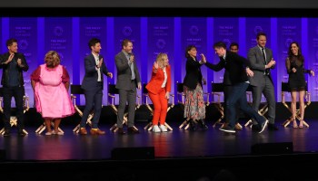 Michael Schur with Amy Poehler, Rashida Jones and the rest of the "Parks and Recreation" cast in 2019.