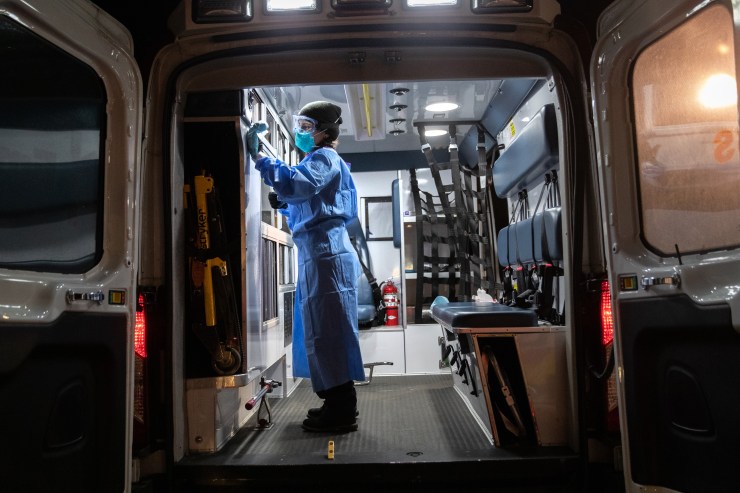 A worker decontaminates an ambulance on April 6, 2020, in Yonkers, New York.