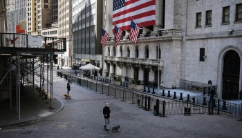 A person walks past an empty New York Stock Exchange building on April 2.