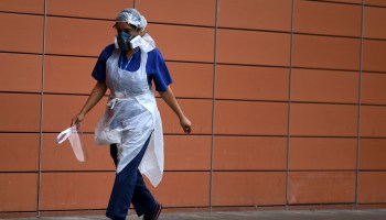A nurse wears personal protective equipment outside the Royal London Hospital.
