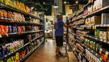 A man shops for packaged foods at a Florida supermarket.