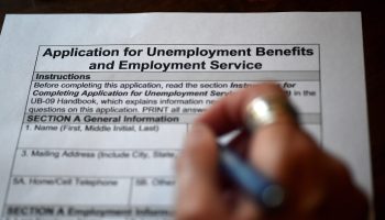 An applicant fills out an unemployment benefits form in Virginia. Temporary relief payments are scheduled to end soon.