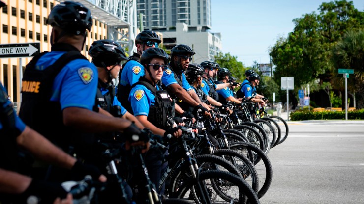 A row of police cyclists is seen during a rally in response to the recent death of George Floyd in Fort Lauderdale, Florida on May 31, 2020.