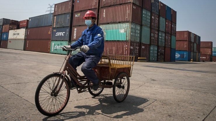 A worker at a container port in Wuhan, China, in April.