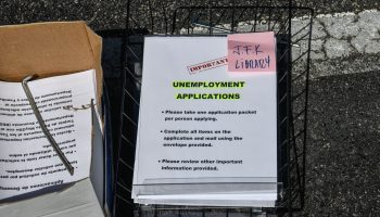 Unemployment application forms outside a Florida library.