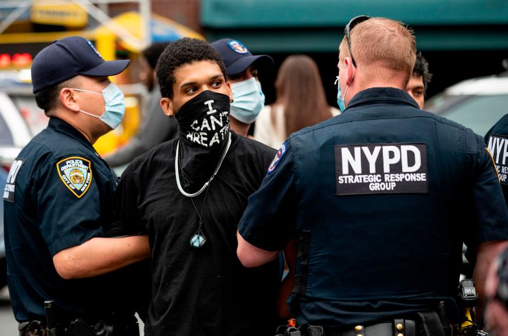 NYPD officers arrest a protestor during a "Black Lives Matter" demonstration on May 28, 2020 in New York City, in outrage over the killing of George Floyd in police custody.