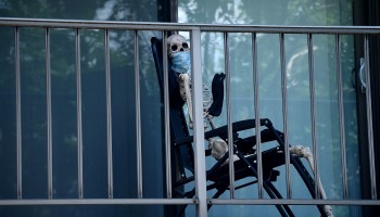 A creepy Halloween skeleton wearing a face mask is on display on a balcony of an apartment, amid the coronavirus pandemic on June 7, 2020 in Washington, DC.