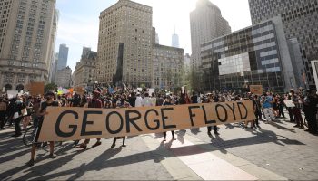 People in New York City protest police brutality and the death of George Floyd.