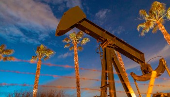 A pump jacks draws crude oil in Signal Hill, California, in March.