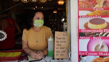 A restaurant owner waits for customers in Key West, Florida.