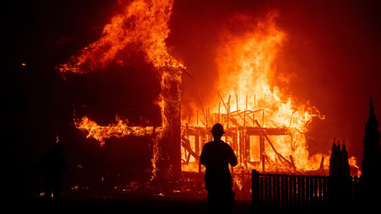 A home burns as the Camp Fire rages through Paradise, California, in November 2018.